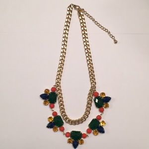 Gold necklace with rich colored jeweled gems